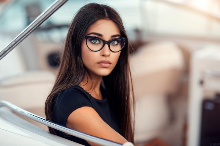 Woman with glasses on a boat