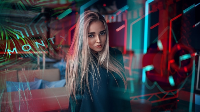Woman in front of "Monty Summer Bar" neon sign