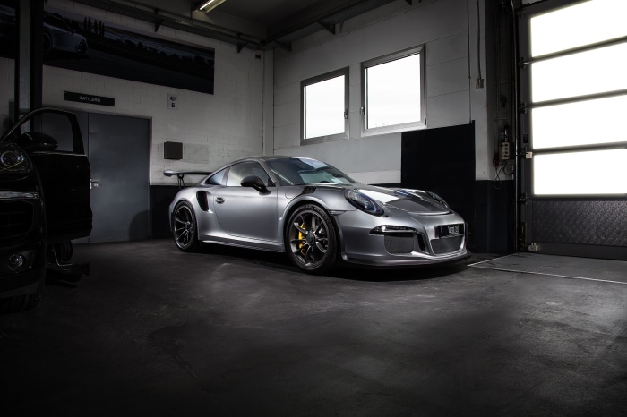 Silver Porsche 911 GT3 in a garage