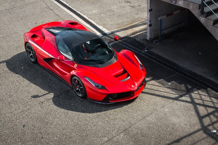 Red Ferrari LaFerrari parked on asphalt