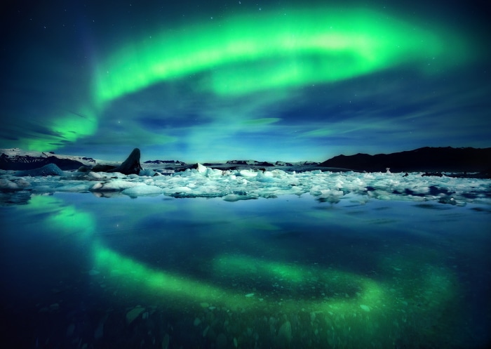 Aurora Borealis over Iceland ice lagoon