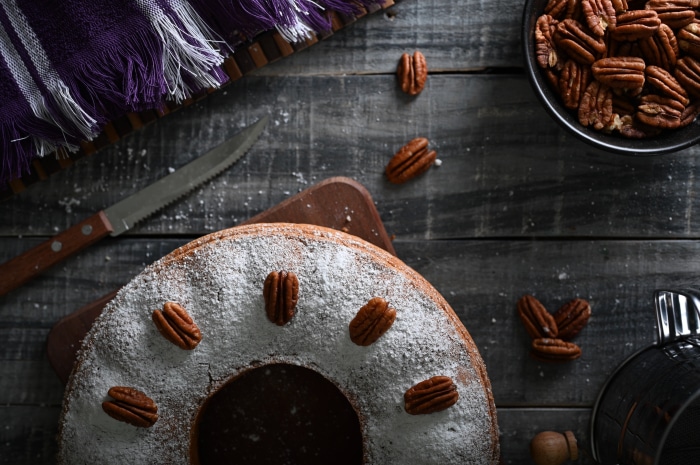 Bundt cake with pecans and powdered sugar