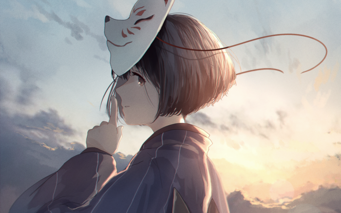 Girl wearing a Kitsune mask at sunset