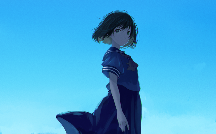 Girl in a school uniform against a blue sky