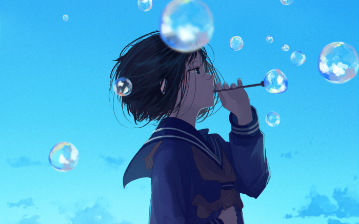 Girl blowing bubbles against a blue sky