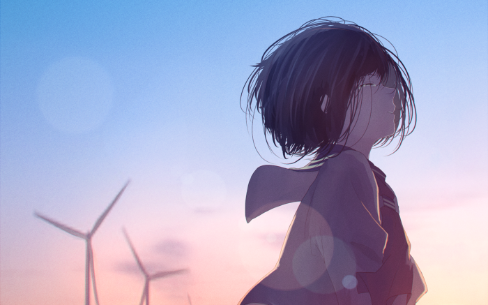 Girl looking up at the sky with windmills