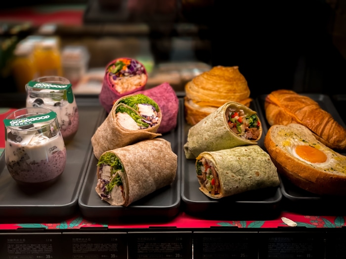 Assorted wraps, pastries, and yogurt parfaits