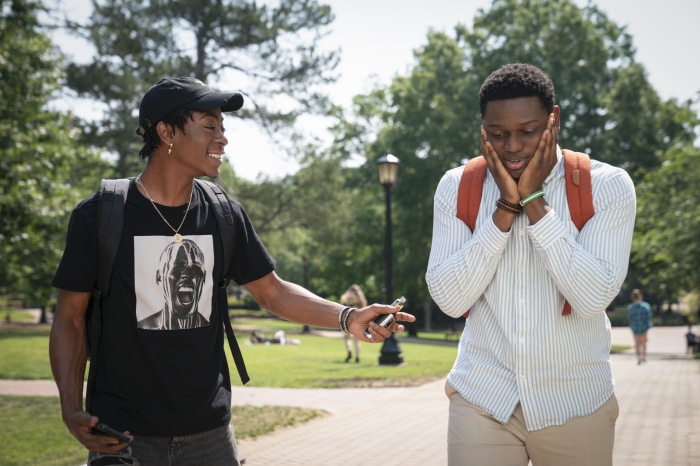 Two young men on a college campus