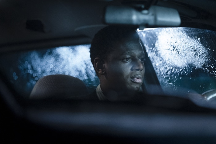 Man driving a car in the rain