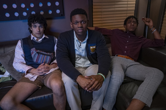 Three young men sitting on a couch
