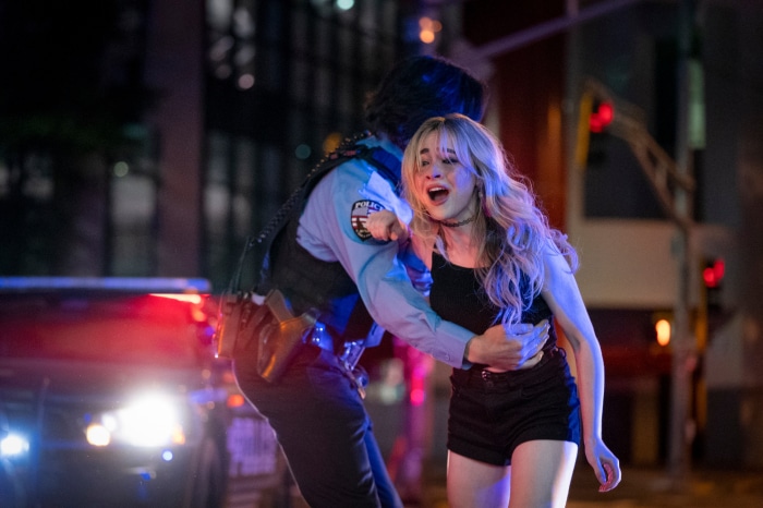 Sabrina Carpenter in a police arrest scene