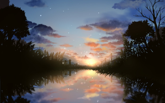Sunset over a calm lake with silhouetted trees