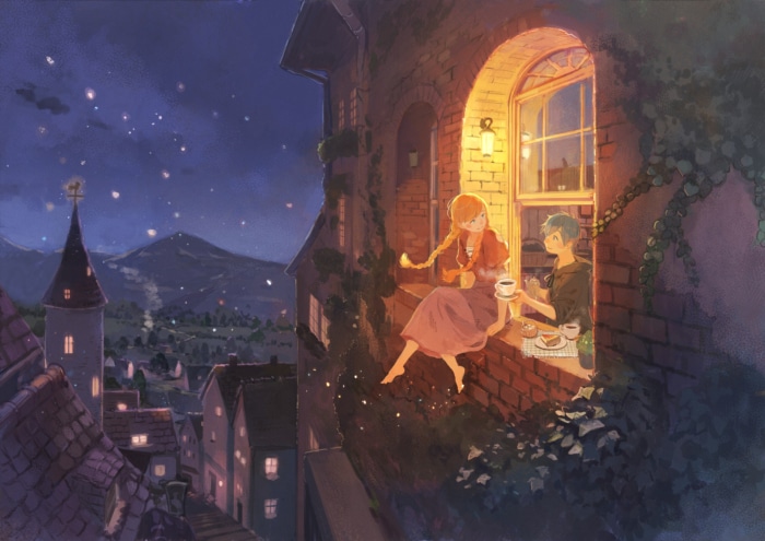 Couple enjoying drinks on a balcony at night