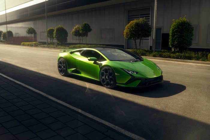 Green Lamborghini Huracán Tecnica driving on road