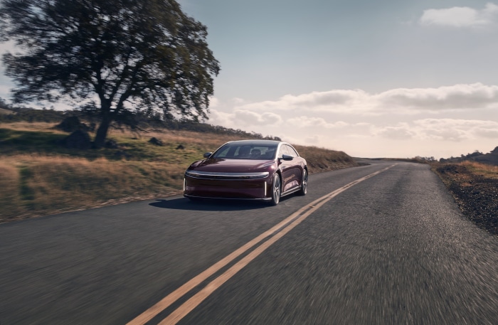 Lucid Air Grand Touring driving on a road