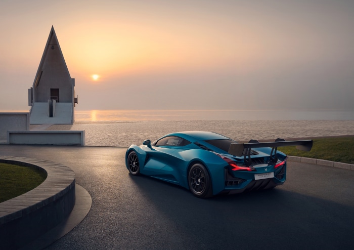 Arcfox-GT sports car by the sea at sunset