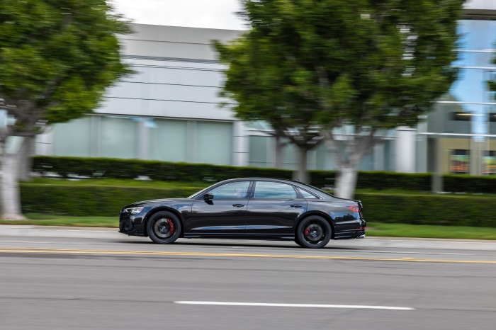Black Audi S8 driving on a road