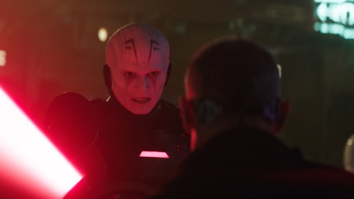 The Grand Inquisitor from Star Wars with a lightsaber