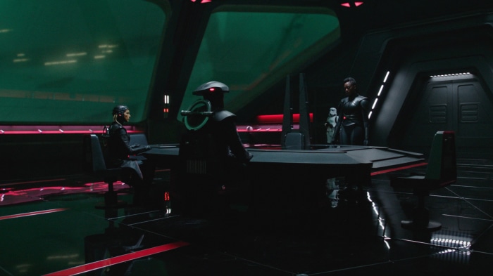 Characters in a futuristic room