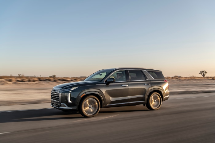 Hyundai Palisade driving on a desert road