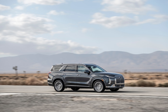 Hyundai Palisade driving on a desert road