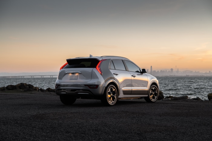 Silver Kia Niro 4K by the water