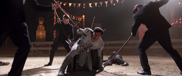 Moon Knight fighting men with staffs