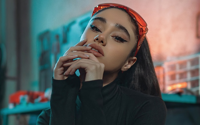 Model with red glasses and black top