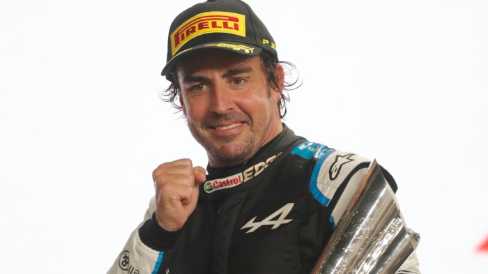 Fernando Alonso with trophy and Pirelli cap