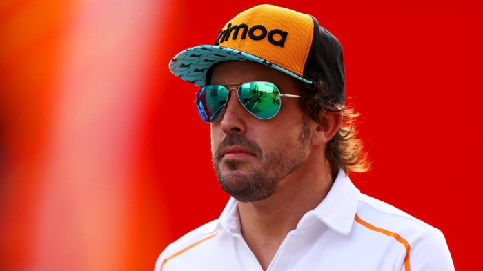 Fernando Alonso wearing sunglasses and a cap