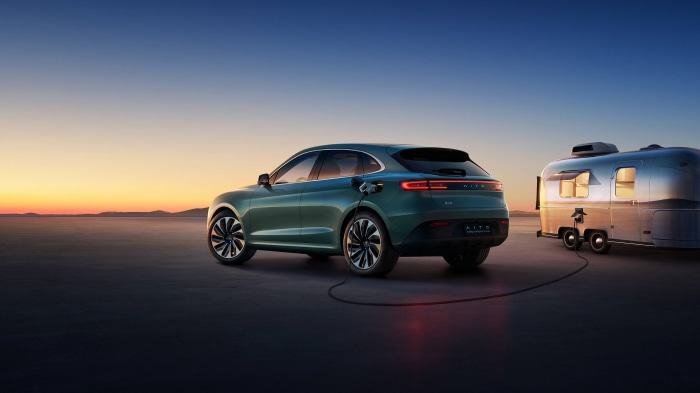 AITO M5 electric car charging a trailer