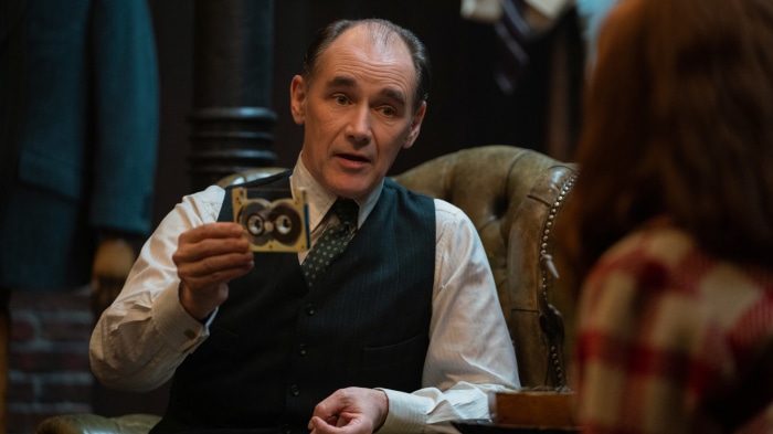 The Outfit: Leonard Burling holds a device