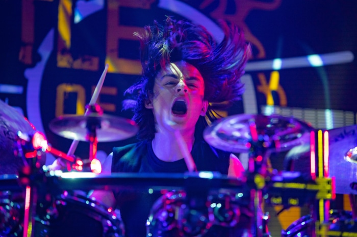 Jaeden Martell playing drums in Metal Lords