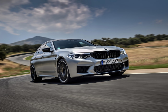 Silver BMW M5 Competition on a Racetrack