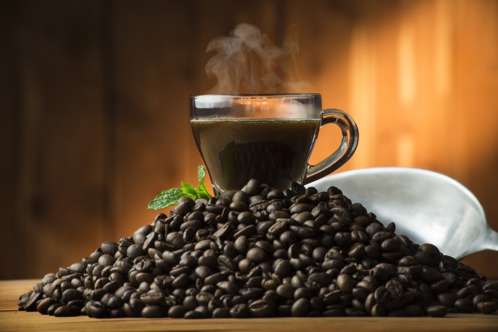 Hot Coffee in a Glass Cup with Beans
