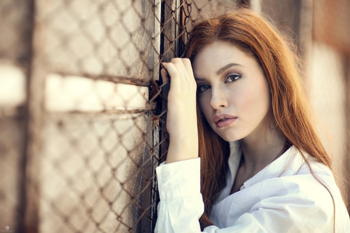 Model Valentina Galassi leaning on a fence