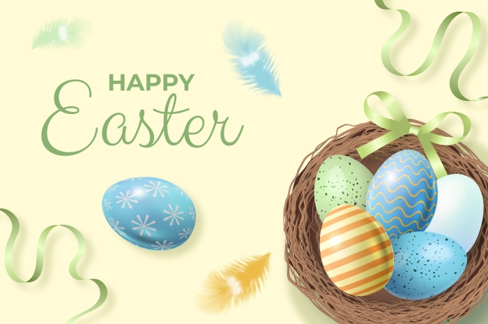 Happy Easter eggs in a nest with feathers and ribbons
