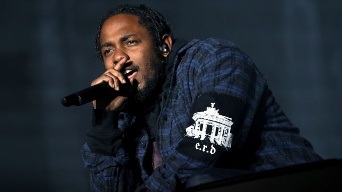 Kendrick Lamar performing on stage
