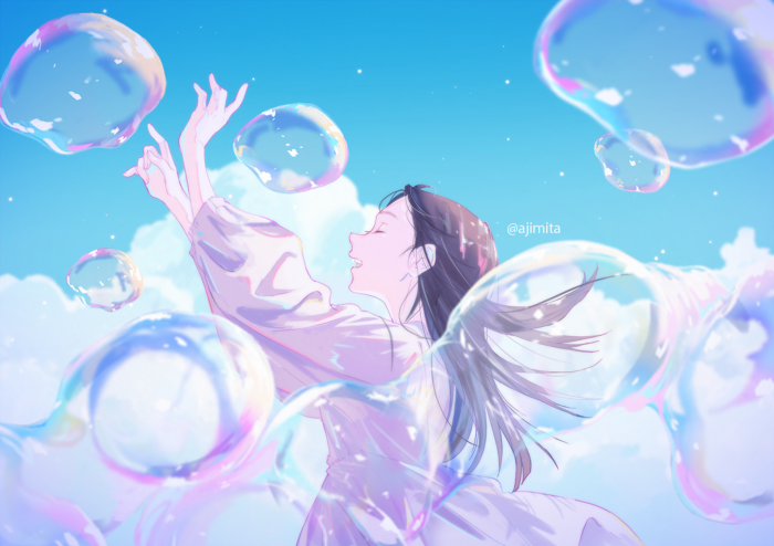 Girl playing with bubbles in the sky