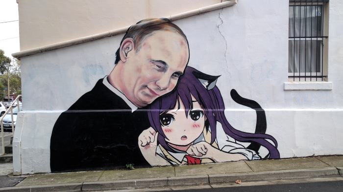 Vladimir Putin embracing an anime character with cat ears