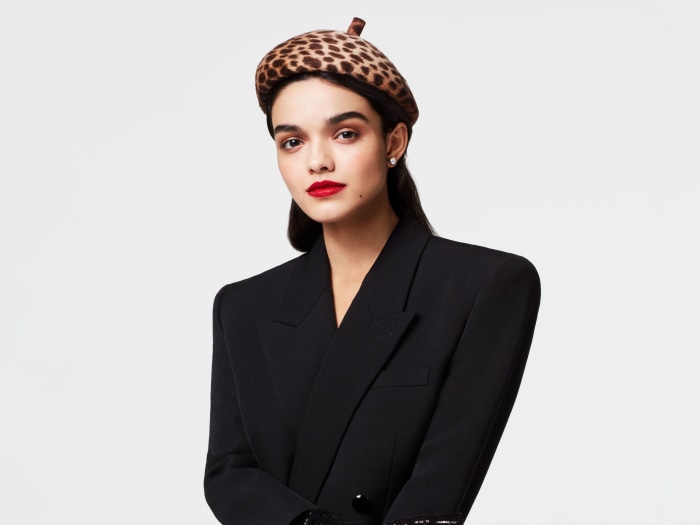 Rachel Zegler in a leopard print beret and black blazer