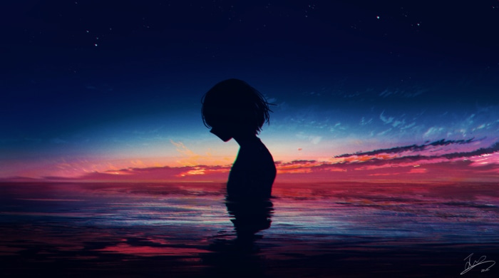 Silhouette of a girl in the ocean at sunset