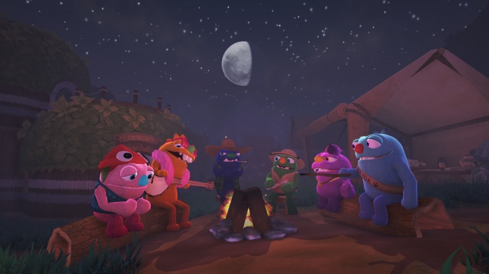 Bugsnax characters around a campfire at night