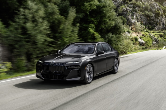 Black BMW 760i xDrive driving on a road