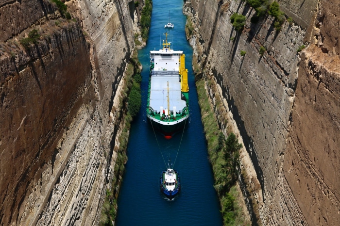 Ship and tugboat in Corinth Canal, Greece