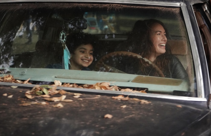 Lena Headey and child in car