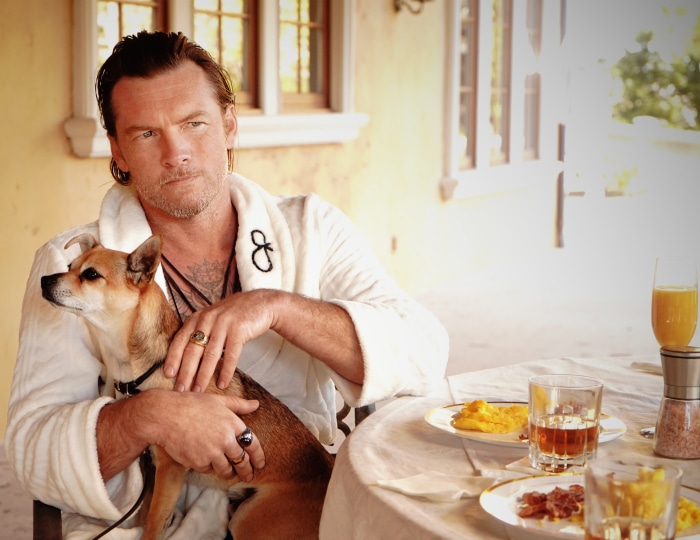 Sam Worthington with dog and breakfast