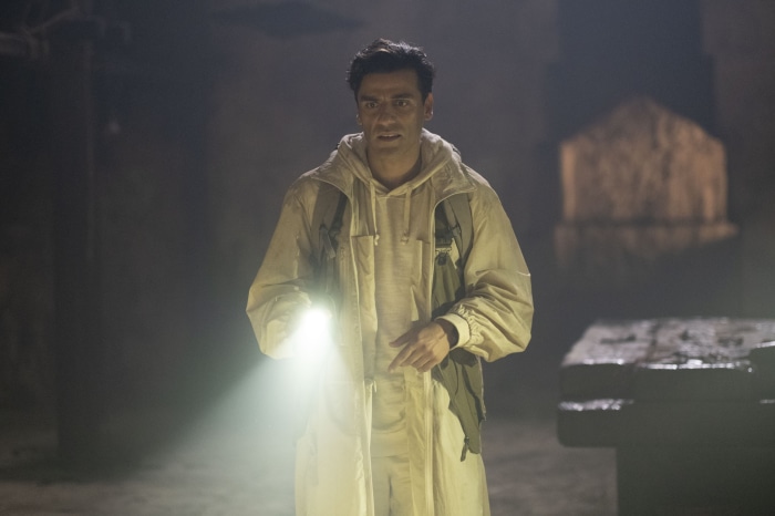 Marc Spector from Moon Knight holding a flashlight