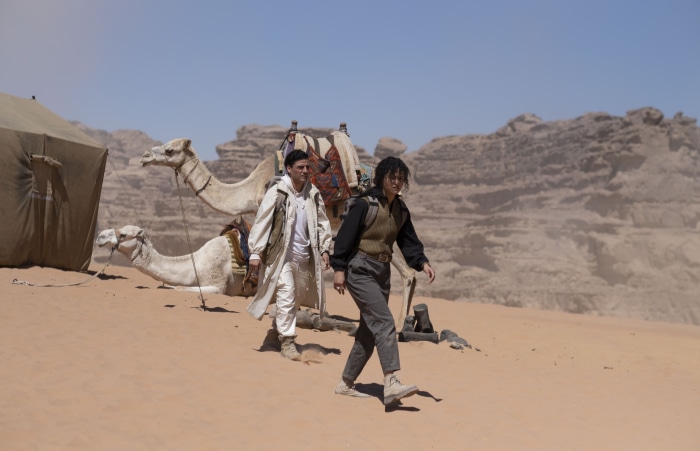 Marc Spector and Layla El-Faouly with camels in desert
