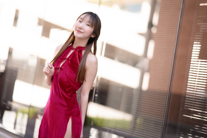 Young Asian woman in a red dress